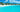 White villas and palm trees along the turquoise shoreline of Maundays Bay in Anguilla