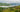 Village along the Congo River with lush green hills in the Democratic Republic of the Congo