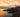 Douglas Head Lighthouse on a rocky cliff at sunset, overlooking the Irish Sea, Isle of Man