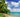 Palm trees and canoes on a quiet beach in Kiribati.