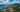 Aerial view of Portsmouth and Cabrits Peninsula with forested mountains and Caribbean coastline, Dominica