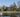 Scene in Regent’s Park, London with ducks and people walking by the pond