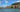 Waterfront view of colorful buildings and palm trees in Philipsburg, Saint Martin.