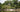 Thatched-roof jungle lodge by a river in Suriname.
