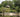 Thatched-roof jungle lodge by a river in Suriname.